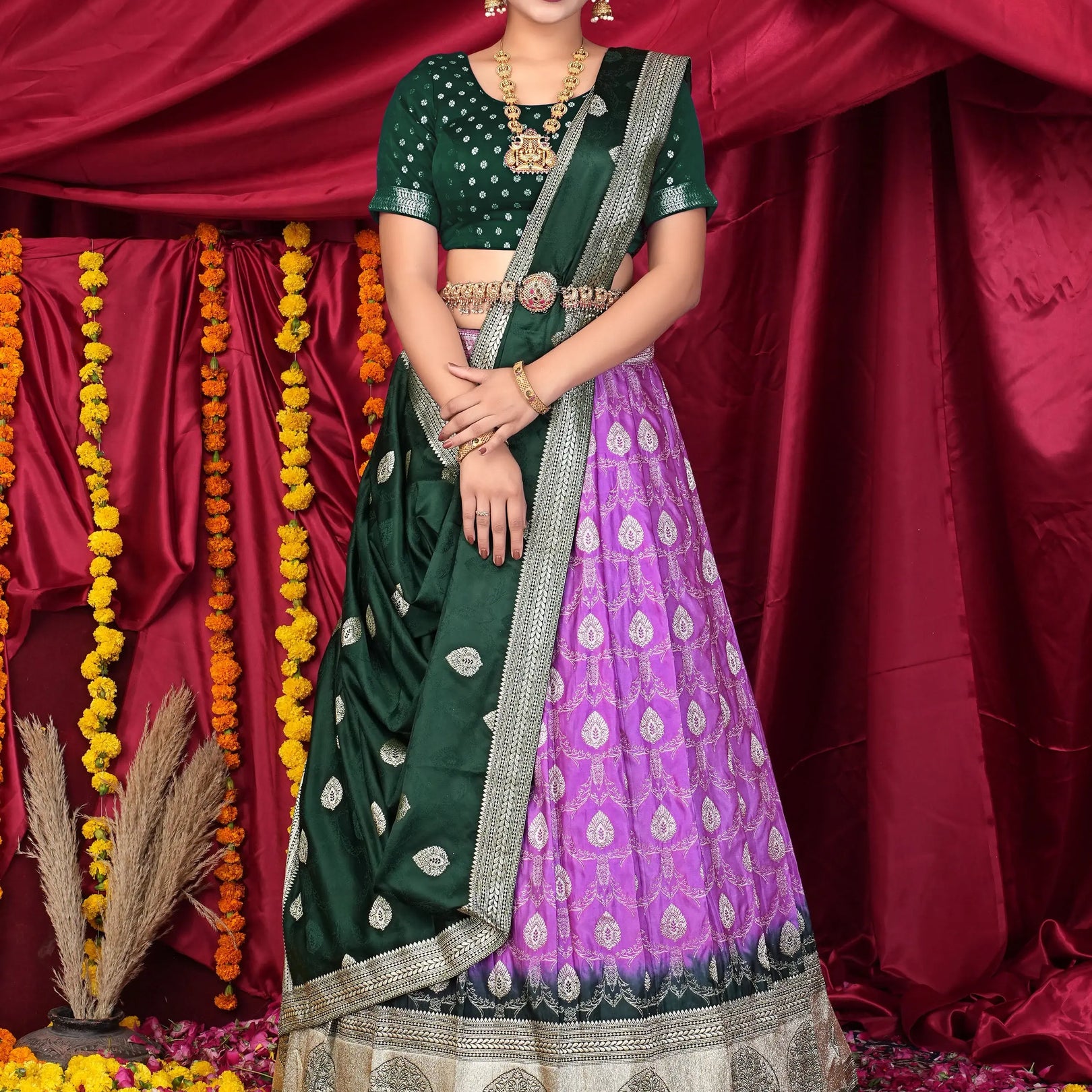 Woman in a green and purple traditional lehenga choli
