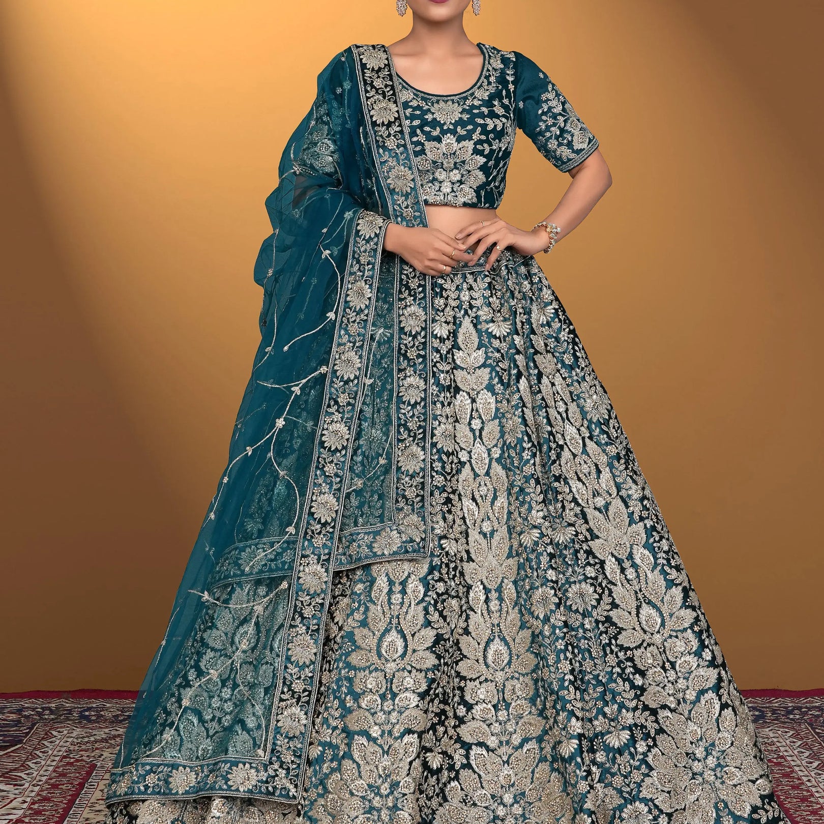 Woman wearing a traditional blue embroidered lehenga choli
