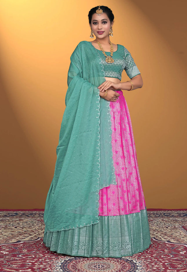 Woman wearing a green and pink lehenga choli