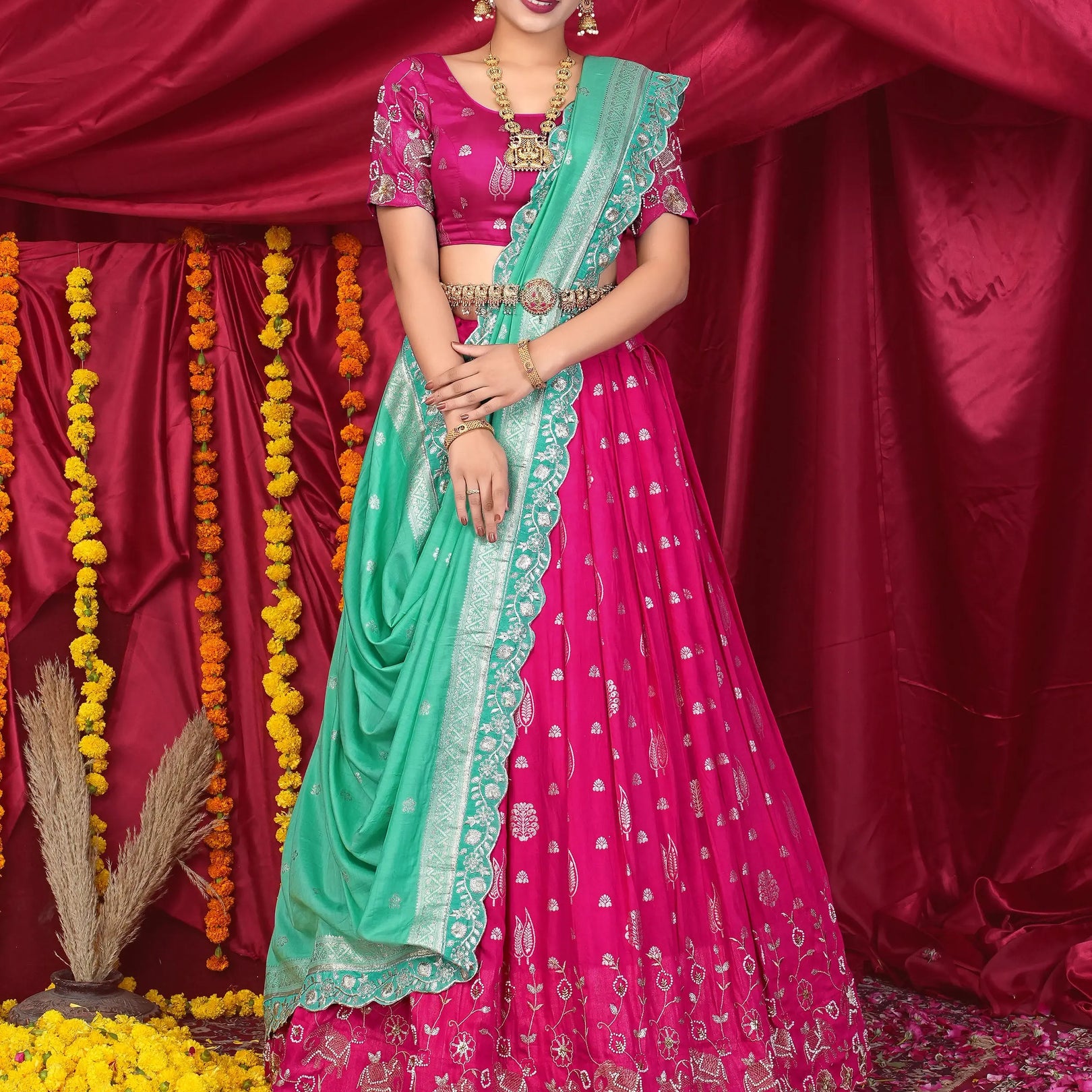 Woman in a pink and green traditional lehenga Choli