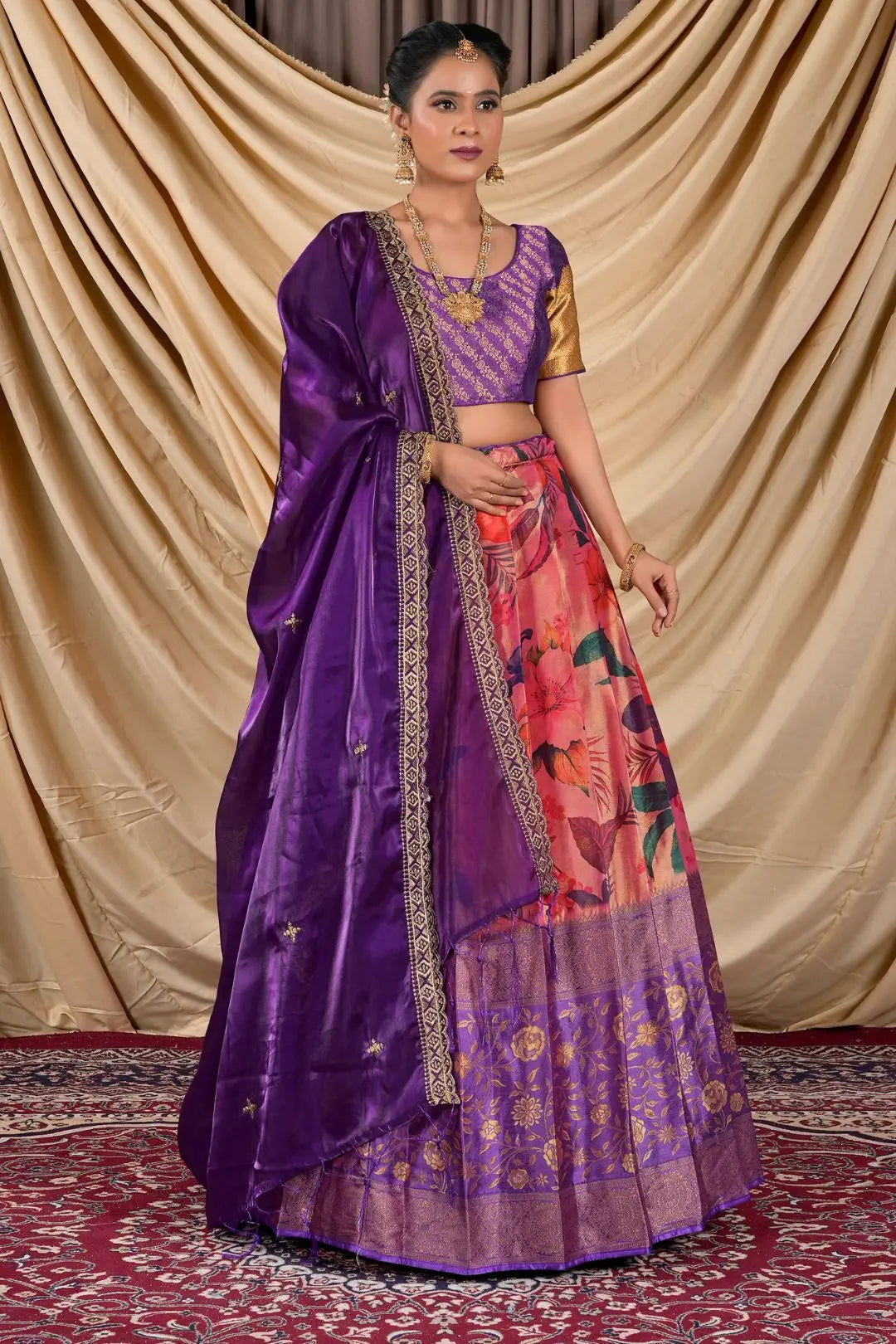 Woman wearing a traditional purple Blouse with a colorful skirt