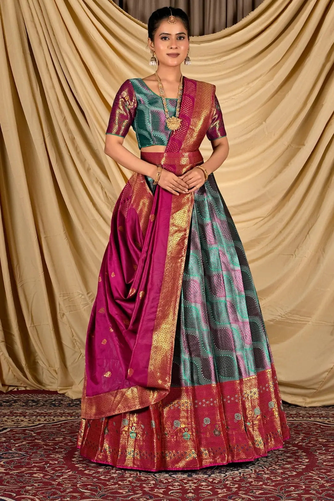 Woman wearing a traditional lehenga choli with a gold border