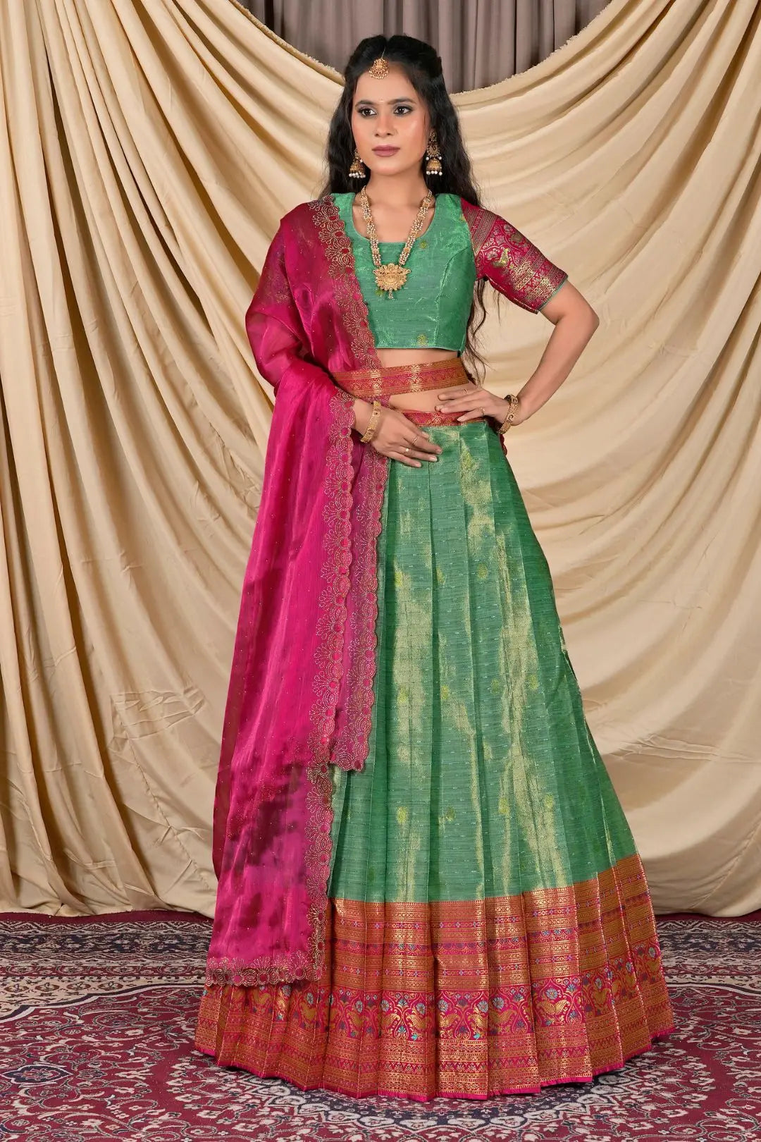 Woman wearing a green and pink traditional outfit