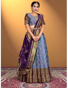 Woman wearing a traditional lehenga choli with a purple and blue color