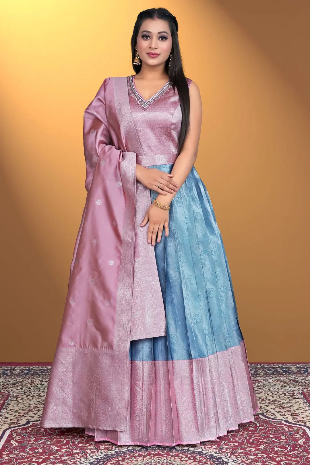 Woman wearing a two-tone pink and blue traditional outfit