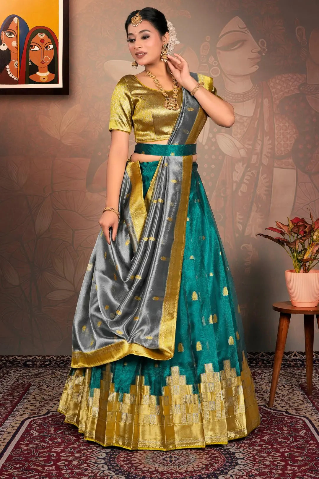 Woman in a traditional outfit with gold, green, and gray colors