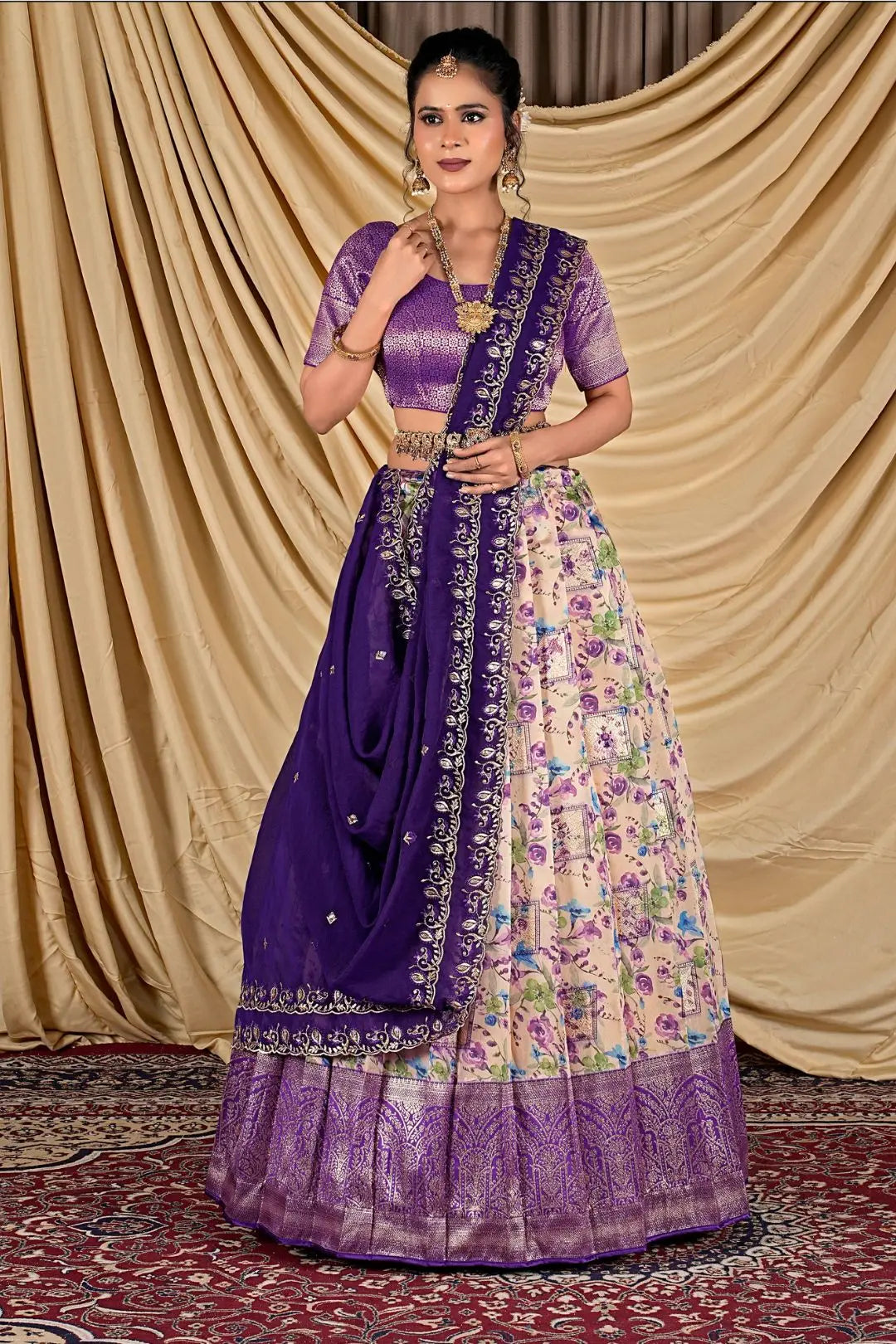 Woman wearing a traditional outfit with a purple blouse and floral skirt