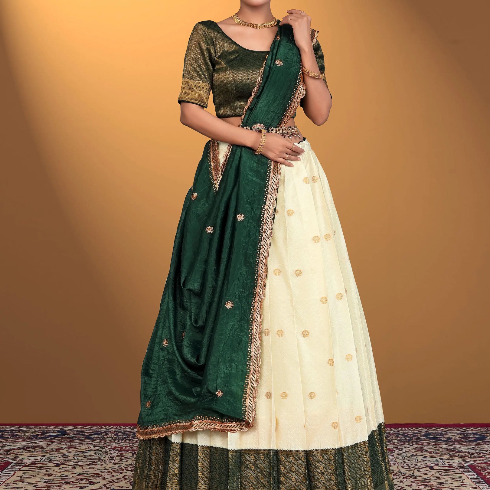 Woman wearing a green and cream traditional outfit