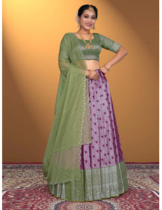Woman wearing a green and purple traditional outfit