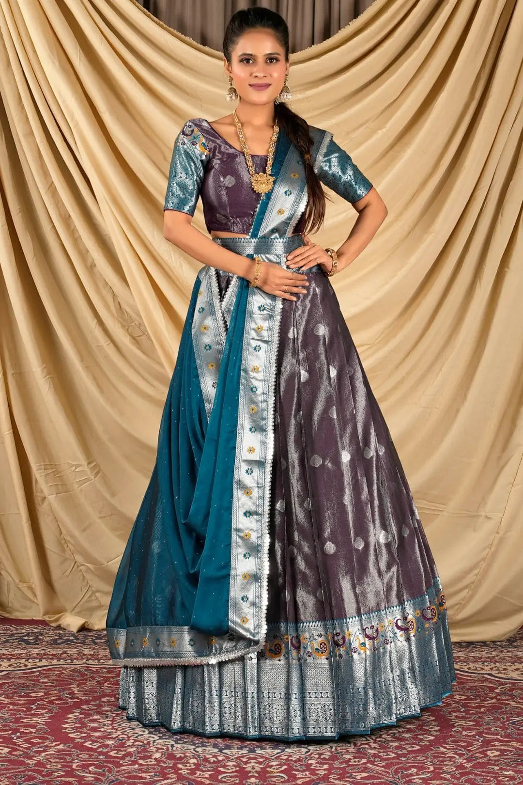 Woman wearing a traditional lehenga choli with a blue and purple