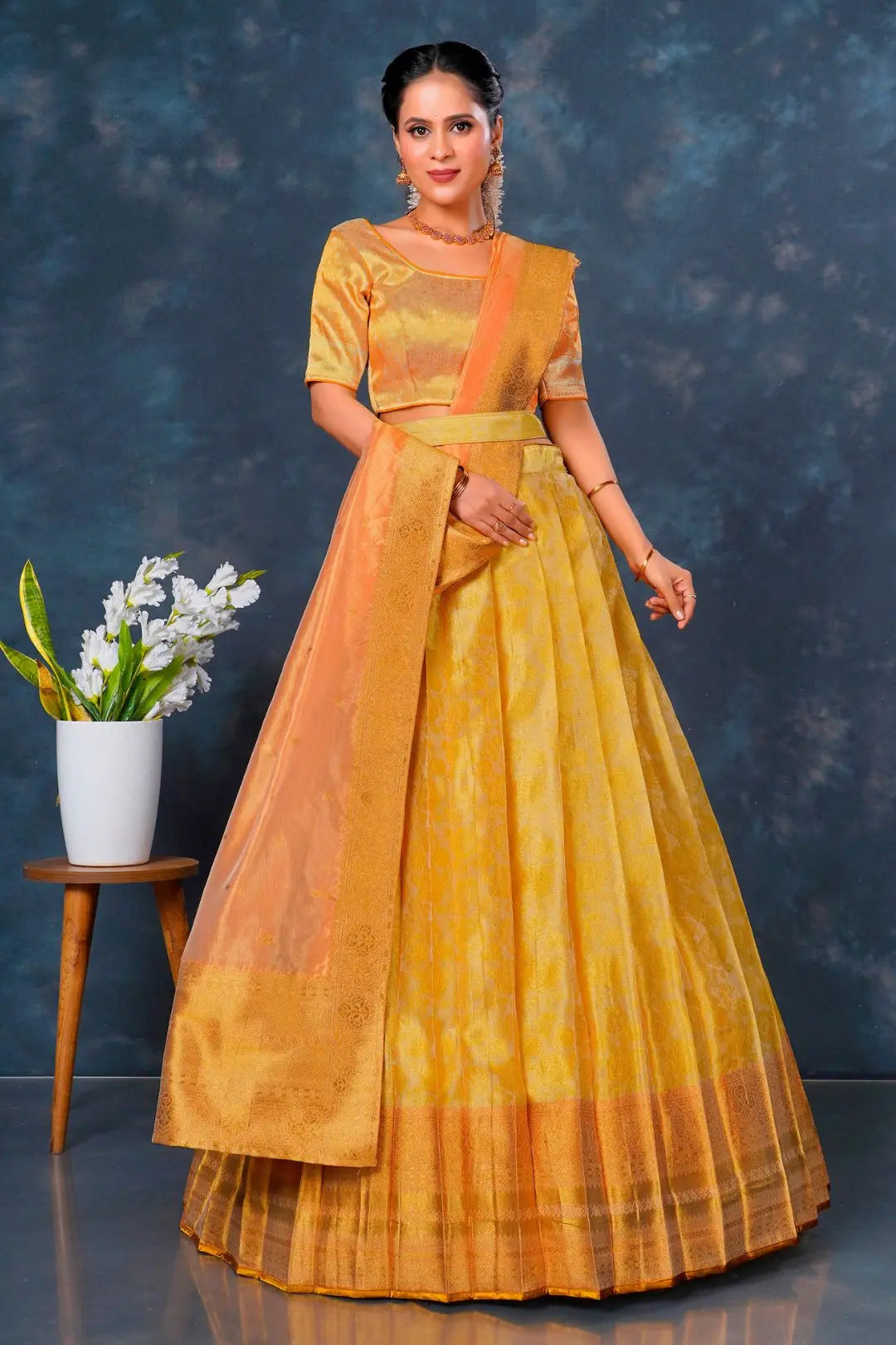 Woman wearing a yellow and orange traditional outfit