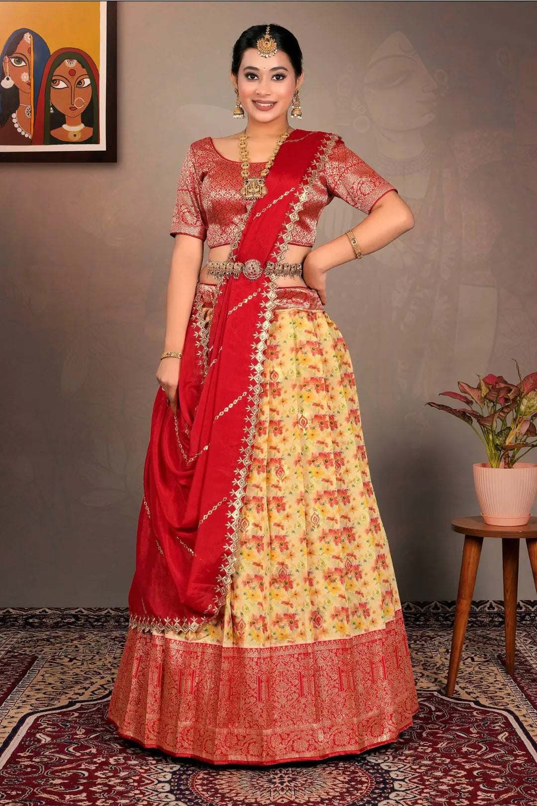 Woman in a red and yellow traditional lehenga choli with dupatta