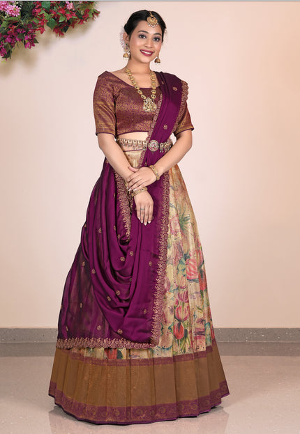 Woman wearing a traditional purple and Chiku Lehenga Choli with a floral pattern