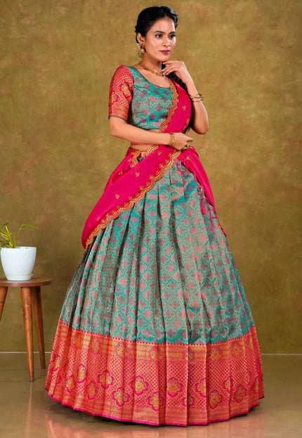 Woman wearing a traditional lehenga with a green and pink design