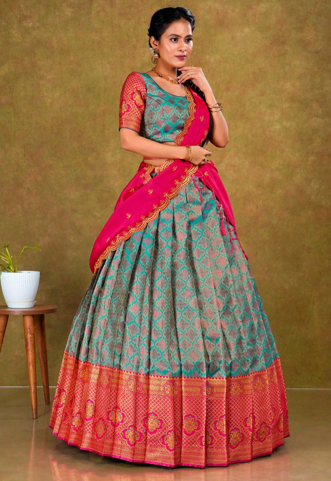Woman wearing a traditional lehenga with a green and pink design