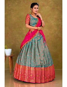 Woman wearing a traditional lehenga with a green and pink design