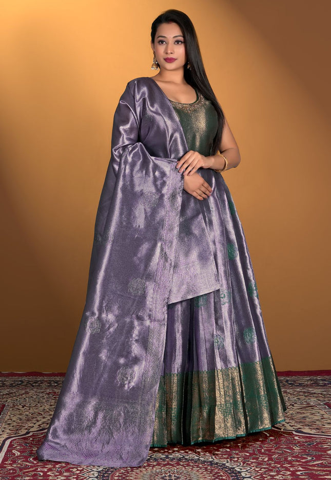 Woman wearing a purple gown with dupatta