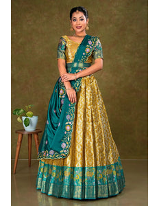 Woman wearing a traditional green and gold lehenga with a matching blouse