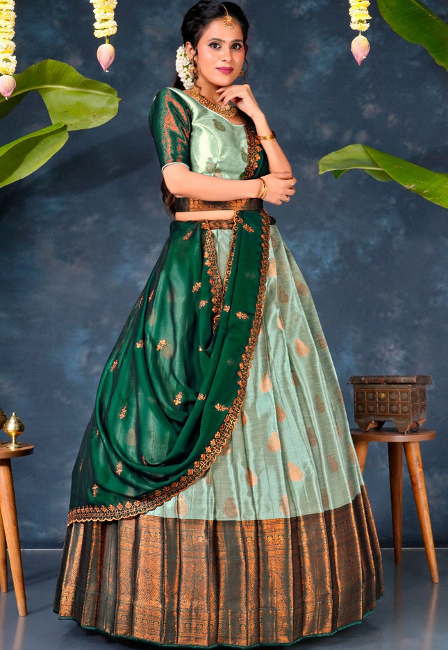 Woman in a traditional green and brown pista lehenga choli with dupatta