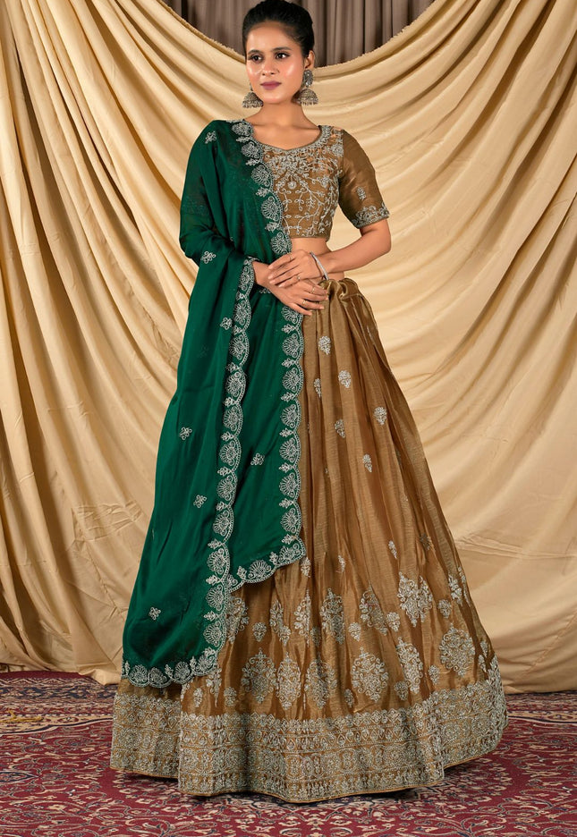 Woman wearing a green and brown traditional outfit with a gold blouse