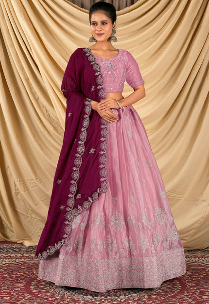 Woman wearing a pink and purple traditional outfit 