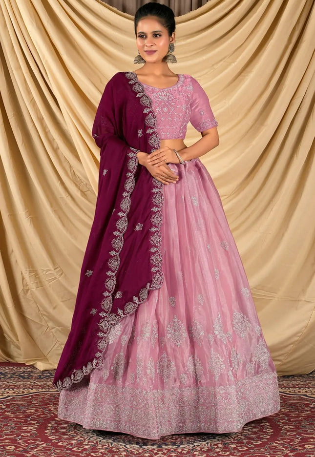 Woman wearing a pink and purple traditional outfit
