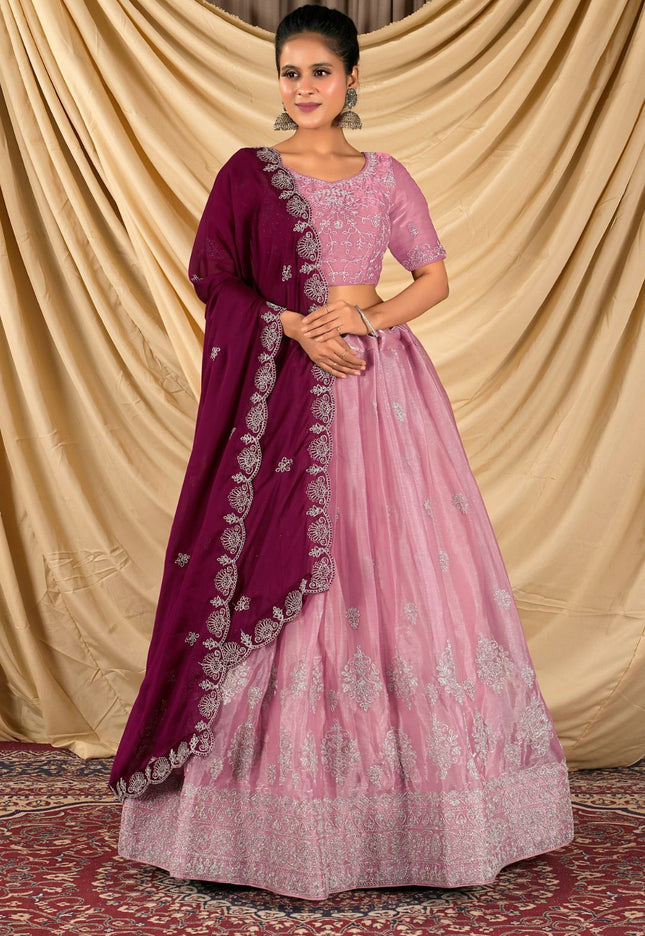 Woman wearing a pink and purple traditional outfit 