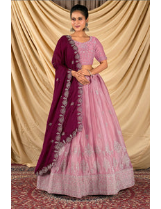Woman wearing a pink and purple traditional outfit 