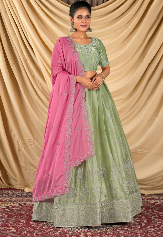 Woman wearing a green and pink traditional outfit