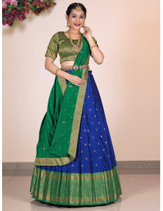 Woman wearing a Blue and green lehenga choli