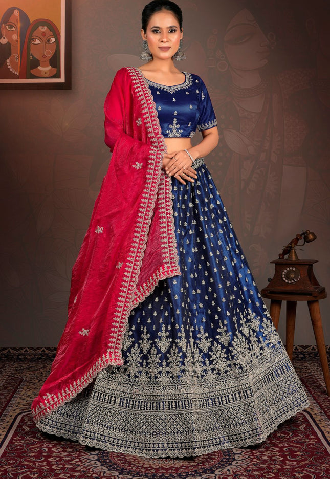 Woman in a blue and red traditional lehenga choli