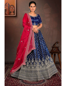 Woman in a blue and red traditional lehenga choli