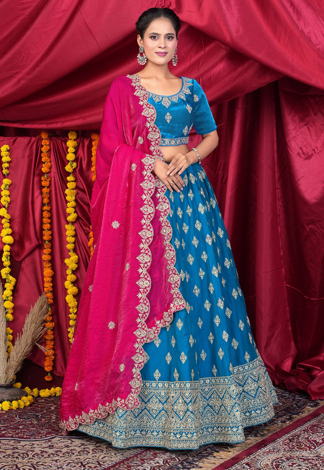 Woman wearing a blue and pink traditional lehenga choli