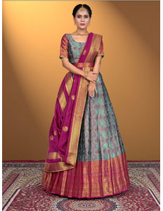 Woman wearing a traditional lehenga choli with a pink border