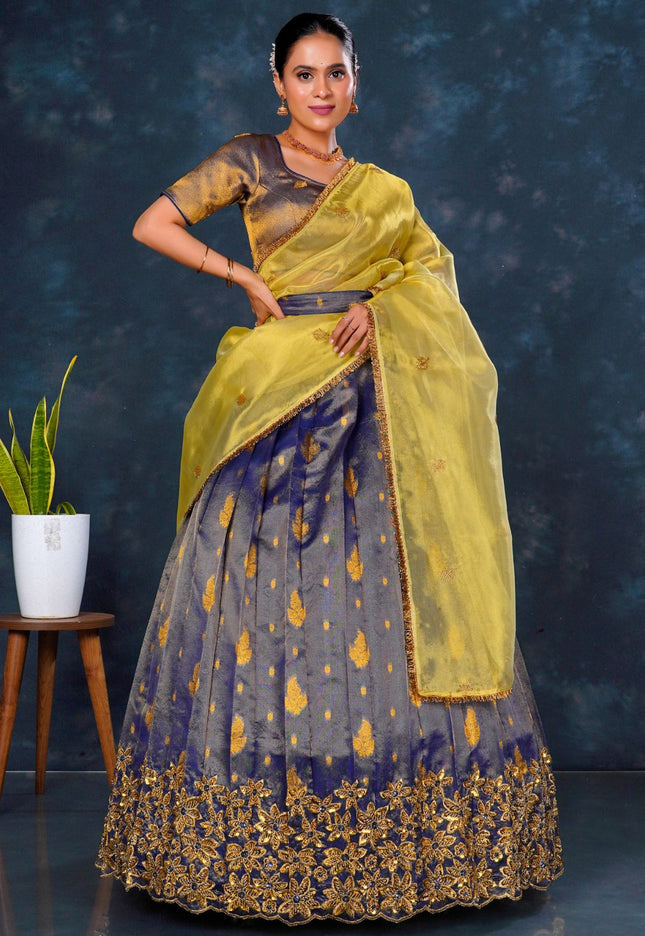 Woman in a traditional outfit with a yellow dupatta
