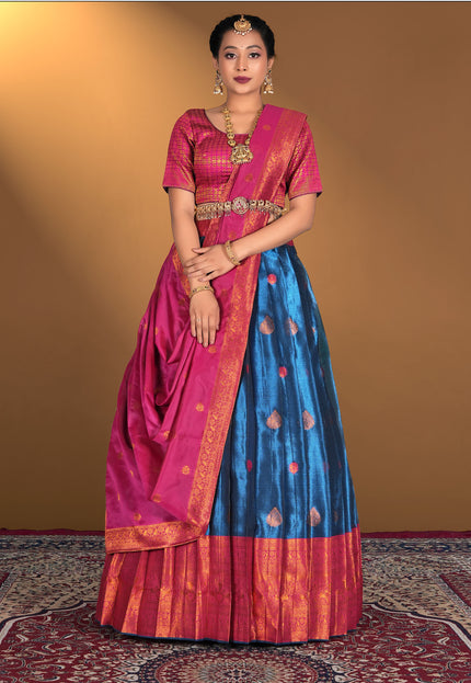Woman wearing a traditional lehenga choli with a pink and blue design