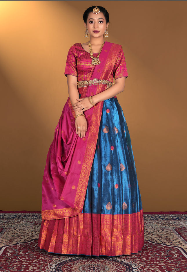 Woman wearing a traditional lehenga choli with a pink and blue design