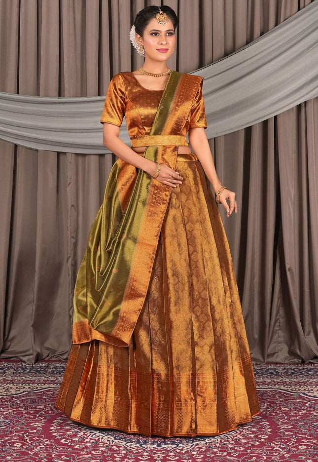 Woman wearing a traditional outfit with a bronze lehenga choli with dupatta