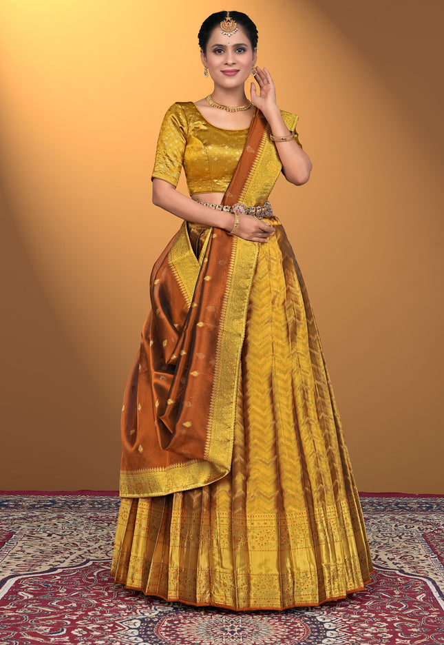 Woman wearing a traditional yellow and brown lehenga choli