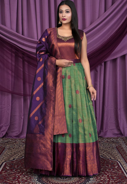 Woman wearing a traditional outfit with a purple and green Gown With Dupatta