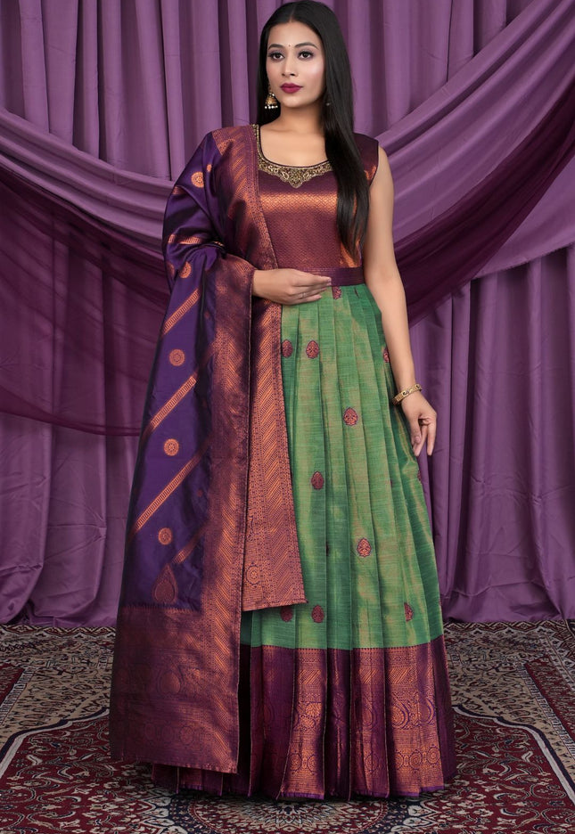 Woman wearing a traditional outfit with a purple and green Gown With Dupatta