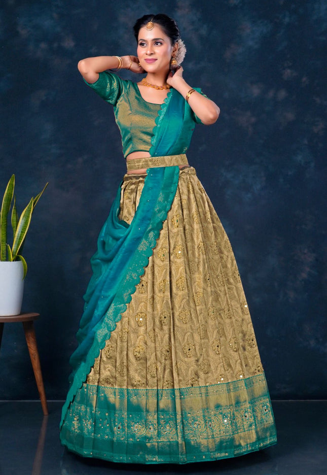Woman in a rama and chiku traditional lehenga choli with dupatta