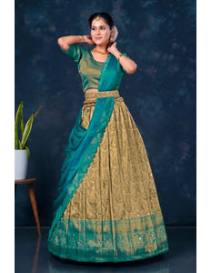 Woman in a rama and chiku traditional lehenga choli with dupatta