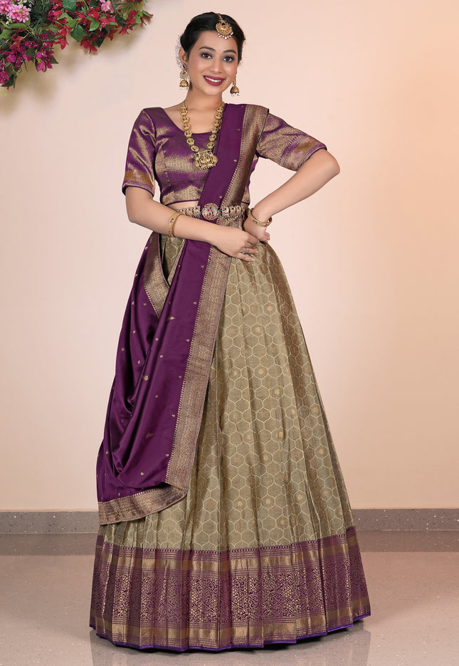 Woman wearing a traditional lehenga choli with a purple border