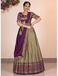 Woman wearing a traditional lehenga choli with a purple border