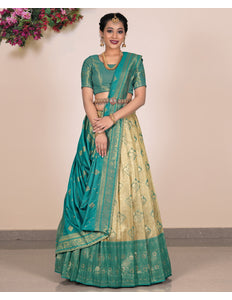 Woman wearing a green and beige traditional outfit