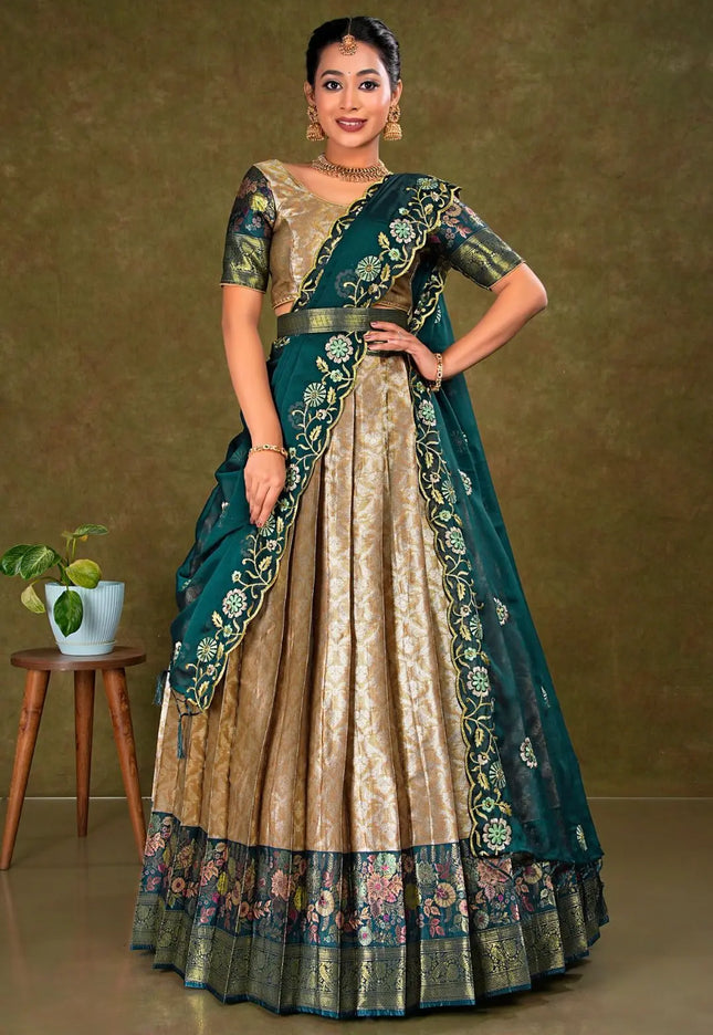 Woman wearing a traditional lehenga with a green and chiku design
