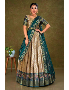 Woman wearing a traditional lehenga with a green and chiku design