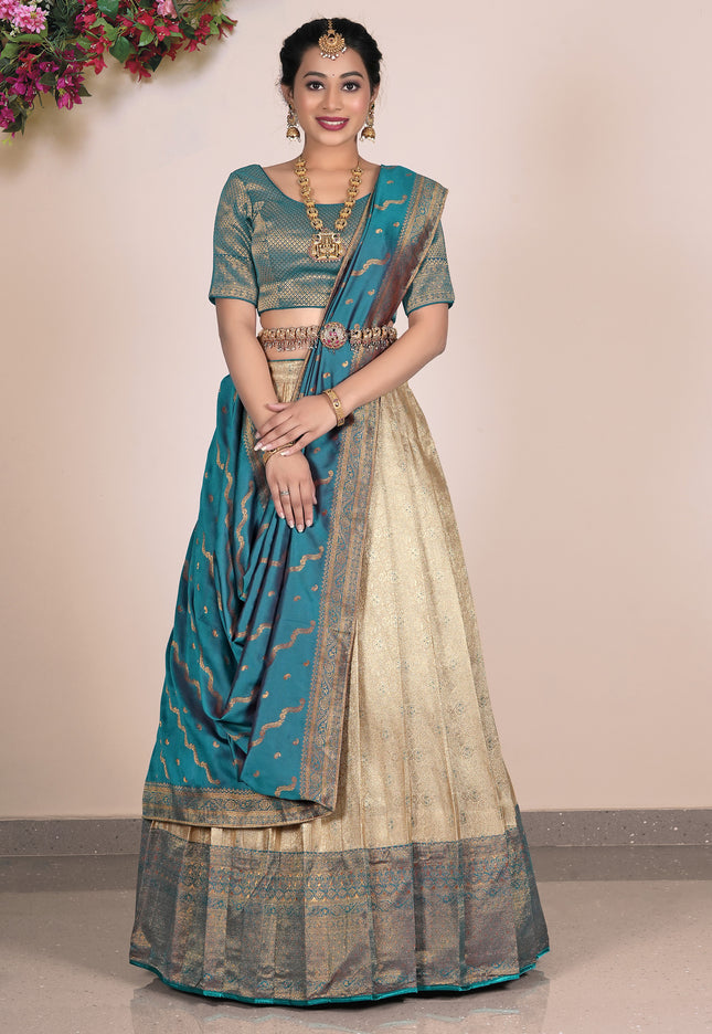 Woman wearing a traditional lehenga with a beige design