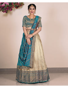 Woman wearing a traditional lehenga with a beige design